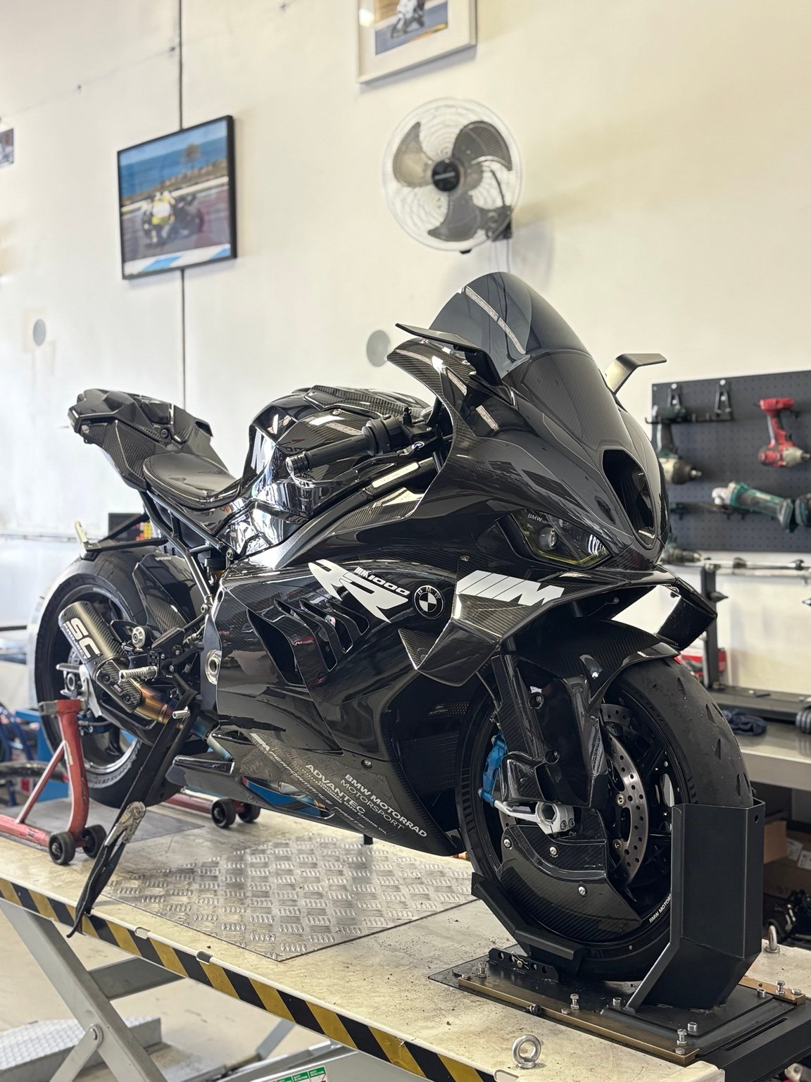 BMW M1000RR on a hoist in the Motopro workshop
